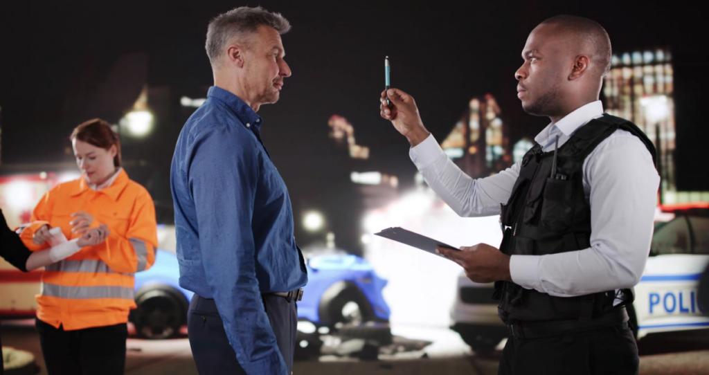 A man doing a field sobriety test at the scene of an accident